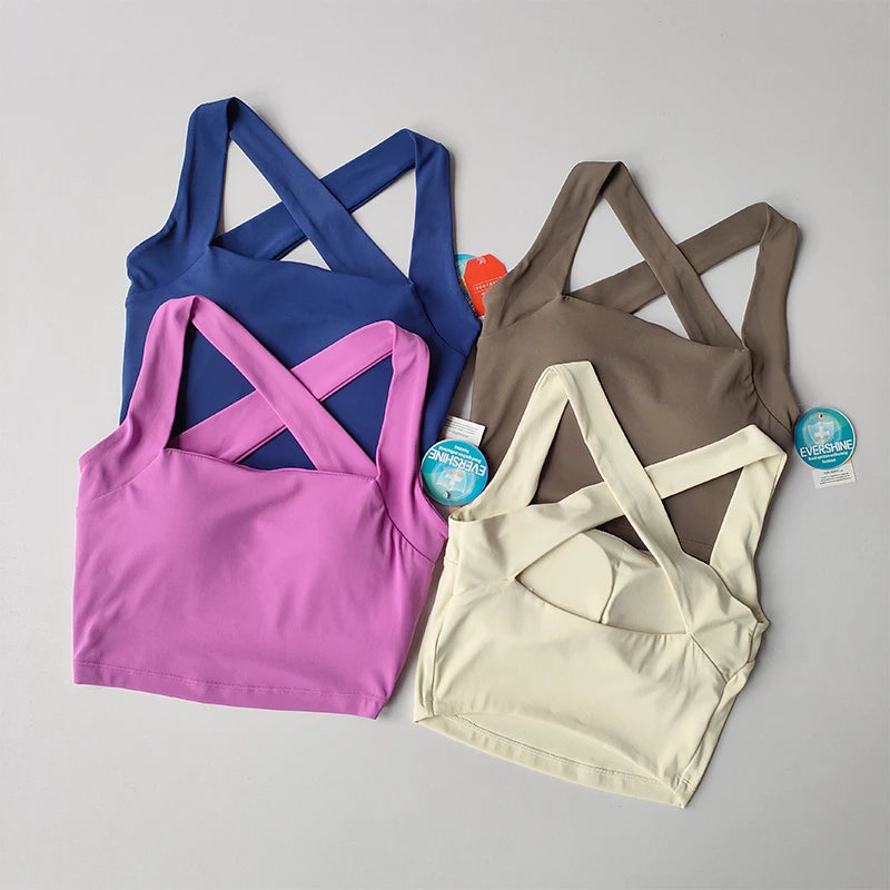 Variety of beauty back yoga bras in blue, pink, brown, and cream for stylish workouts