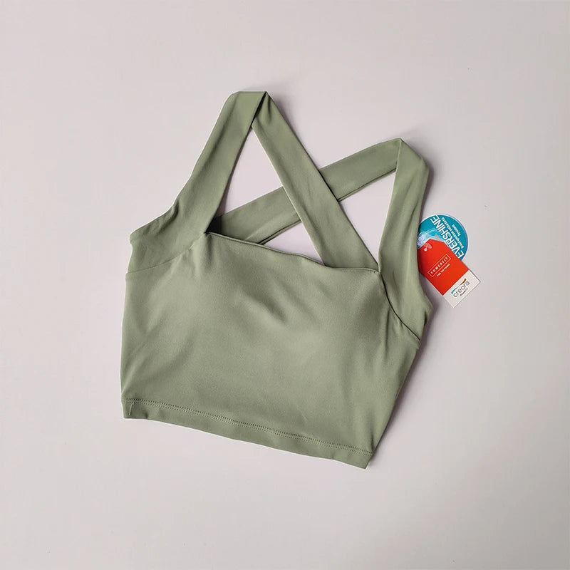 Women's beauty back yoga bra in soft green with stylish cross-back straps for comfortable workouts