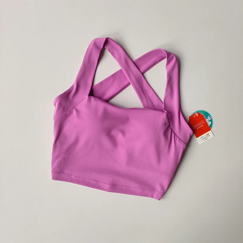 Pink beauty back yoga bra with stylish criss-cross straps for active wear and comfort