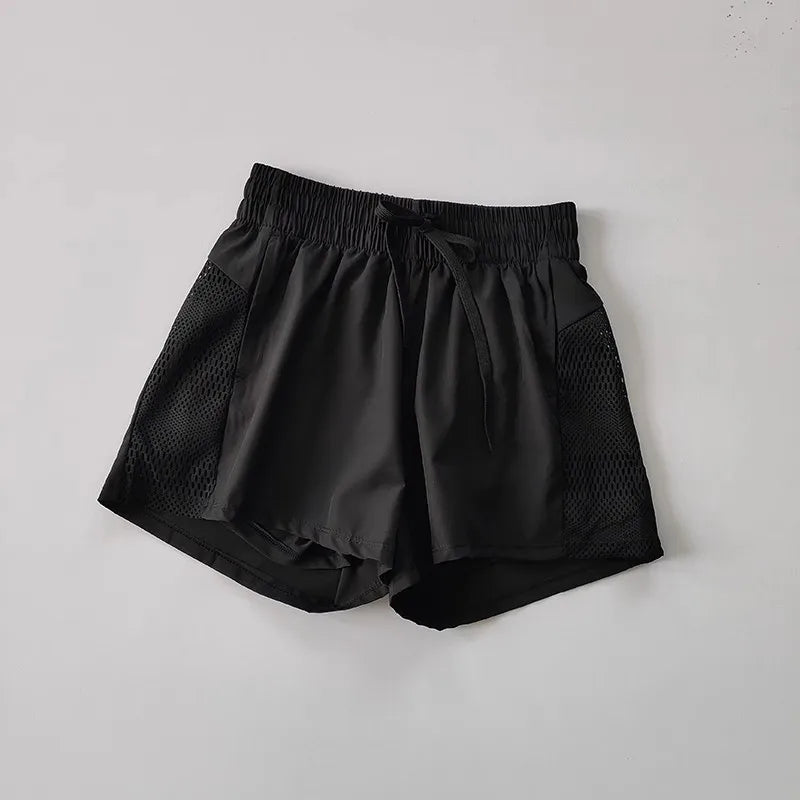 Black breathable gym shorts for women with a comfortable waistband and mesh side panels