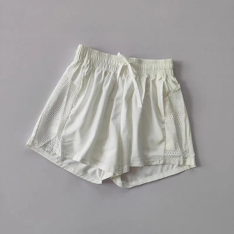 White breathable gym shorts for women with mesh side panels for optimal comfort and airflow