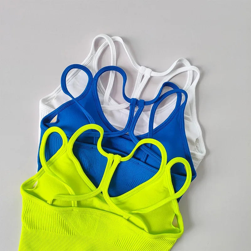 Variety of breathable sports bras for women in white, blue, and neon green colors