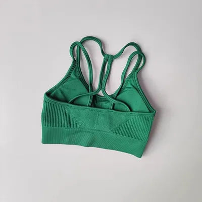 Green breathable sports bra for women with stylish back design and comfortable fit