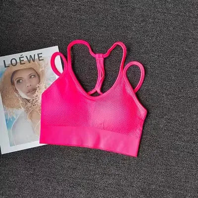 Bright pink breathable sports bra for women with a stylish design and comfortable fit