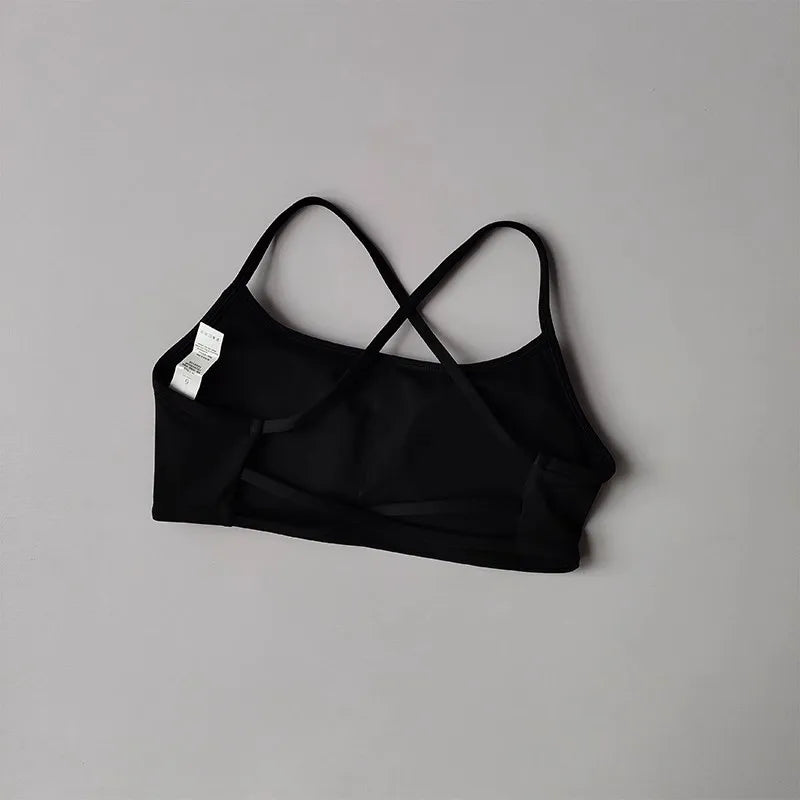 Black cross back sports bra designed for comfort and flexibility during workouts