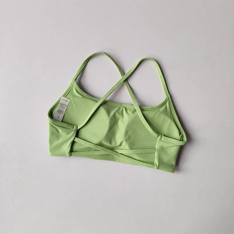 Light green cross back sports bra designed for comfort and support during workouts