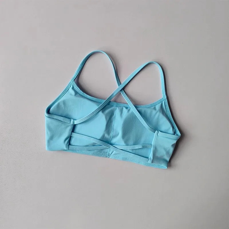 Light Blue Cross Back Sports Bra from The Lady's Haven Boutique with comfortable fit and stylish design