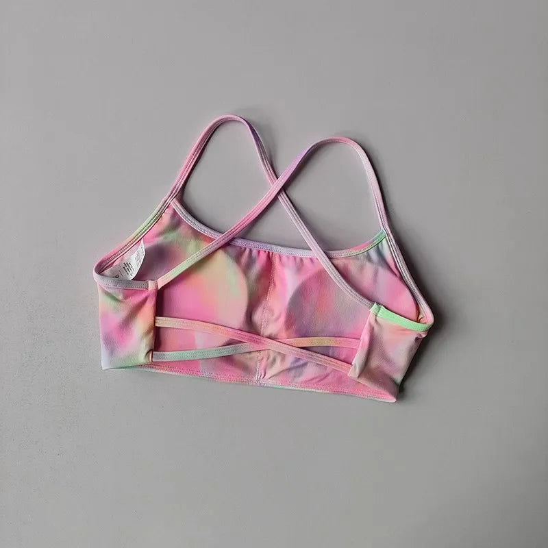 Colorful cross back sports bra from The Lady's Haven Boutique, featuring a stylish design for active wear