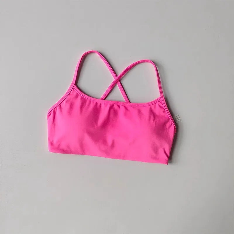 Bright pink cross back sports bra with comfortable straps for active women