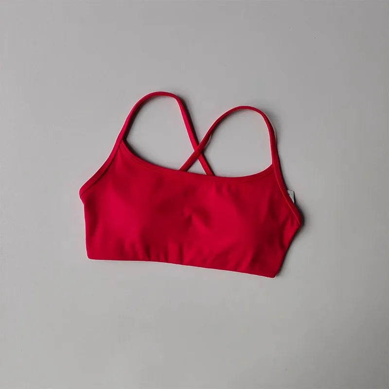 Bright red cross back sports bra designed for comfort and support during workouts