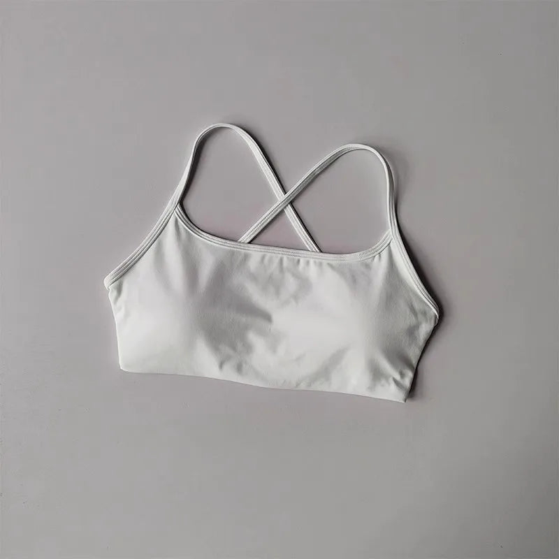 White cross back sports bra from The Lady's Haven Boutique with comfortable and stylish design