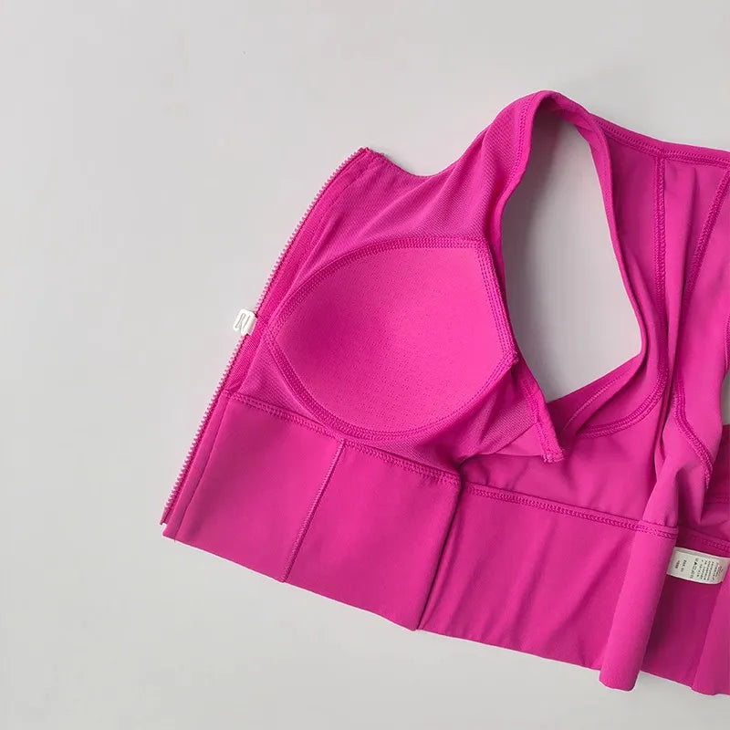 Pink front zipper fitness bra with padded cups for added support and comfort during workouts