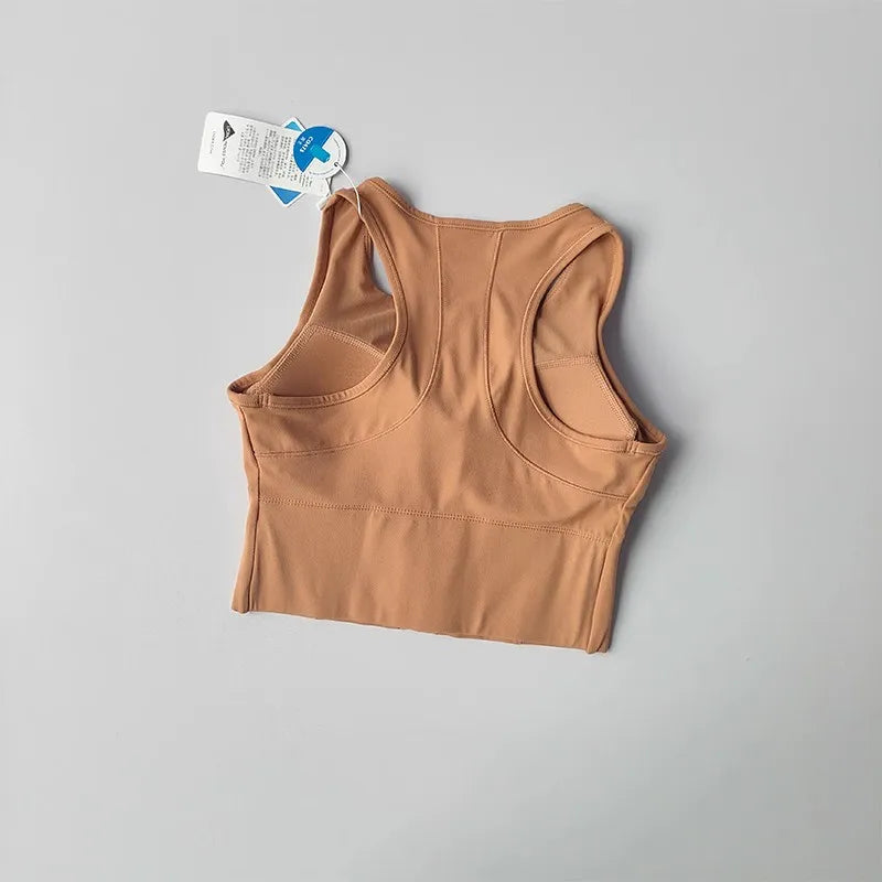 Back view of a front zipper fitness bra in a beige color with a smooth design for active wear