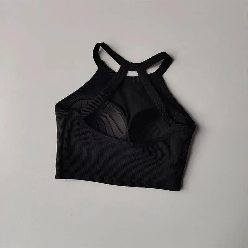 Black gym top fitness camisole with crisscross straps for comfortable workouts