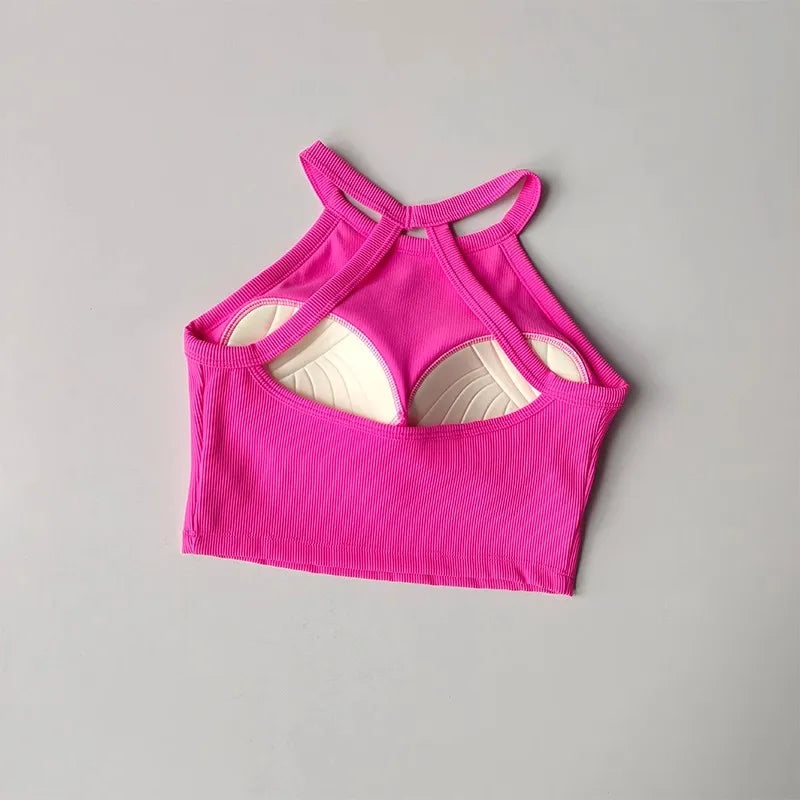 Stylish pink gym top fitness camisole with unique racerback design for active wear