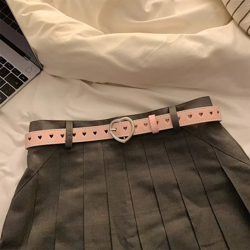 Heart buckle waist belt in pink with heart cutouts, perfect for stylish outfits
