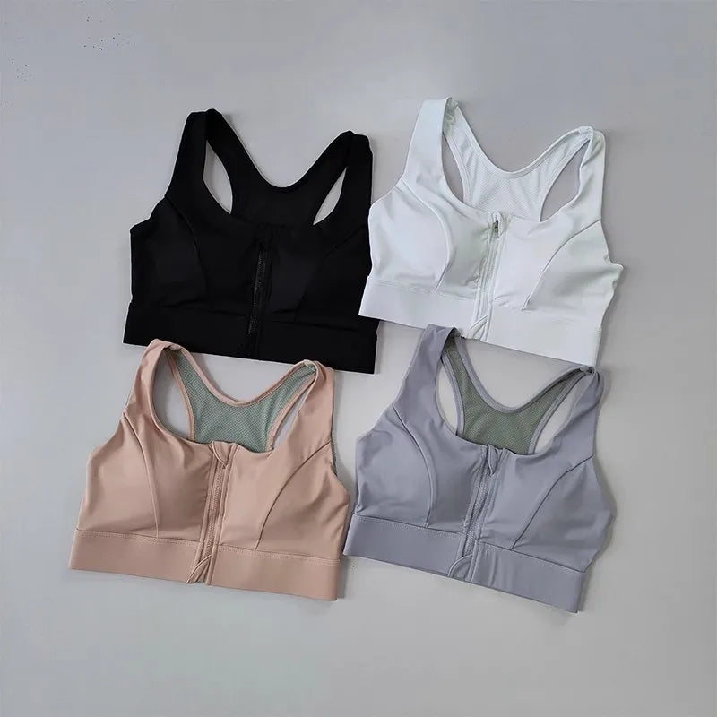Four high impact sports bras for women in black, white, pink, and gray with zip front design