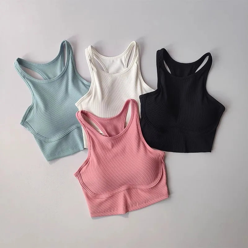 Four high impact sports bras for women in blue, white, black, and pink colors with racerback designs