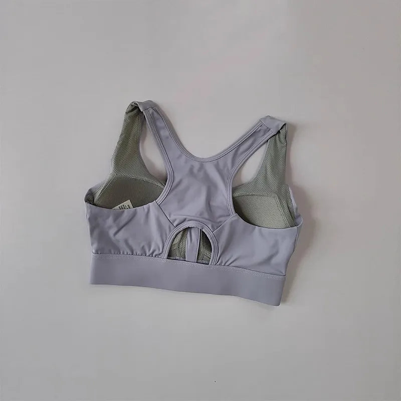 Back view of a gray high impact sports bra for women with a breathable design and supportive straps