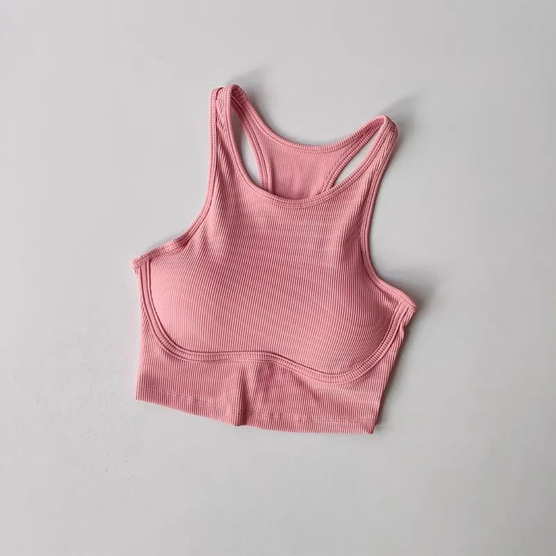 Pink ribbed high impact sports bra for women designed for maximum support during workouts