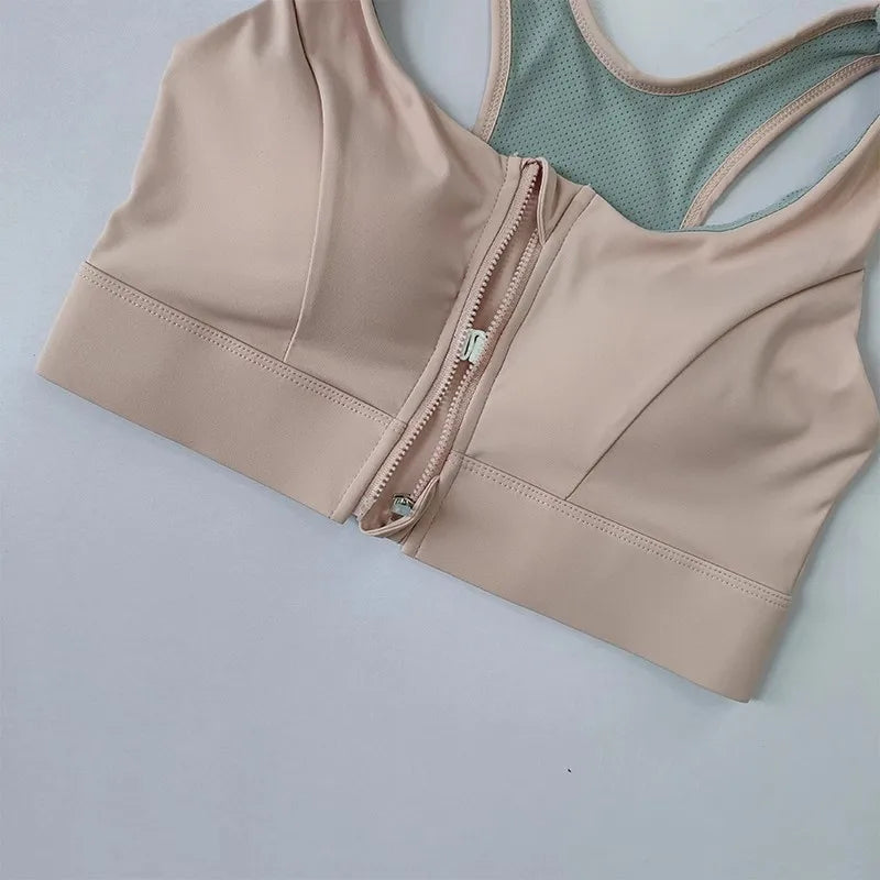 Beige high impact sports bra for women with front zipper closure and breathable back design