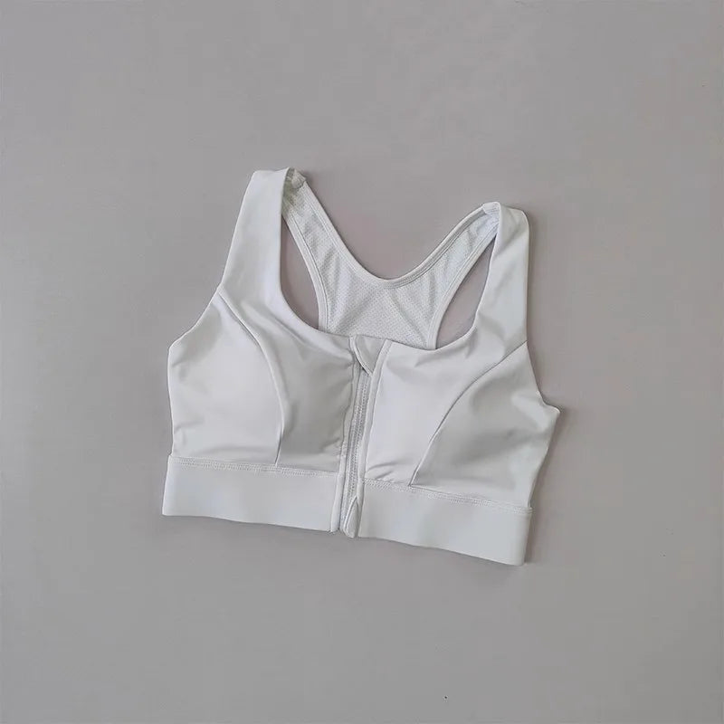 White high impact sports bra for women with front zipper and mesh detailing from The Lady's Haven Boutique