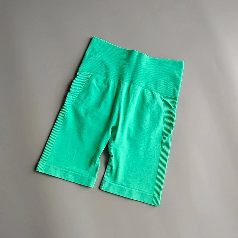 High waist seamless yoga shorts in green color with stretchy fabric for comfortable movement