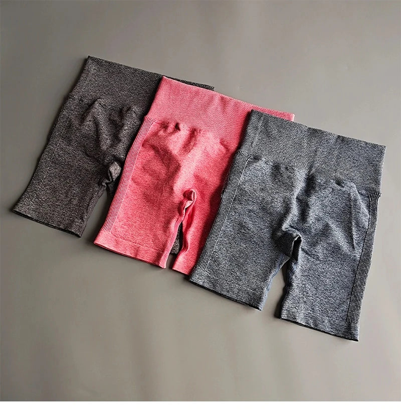 High waist seamless yoga shorts in black, pink, and gray for comfortable workouts and active lifestyle