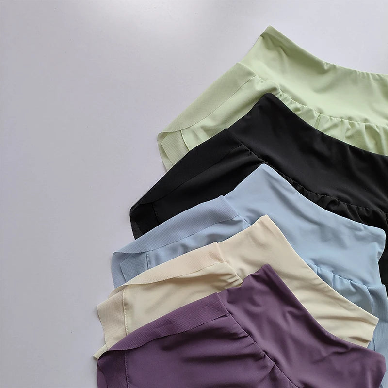 Variety of high-waisted sports shorts women in pastel colors for comfortable workouts