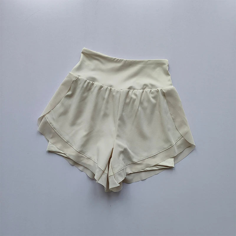 Light beige high-waisted sports shorts women with a flowy design for stylish workouts