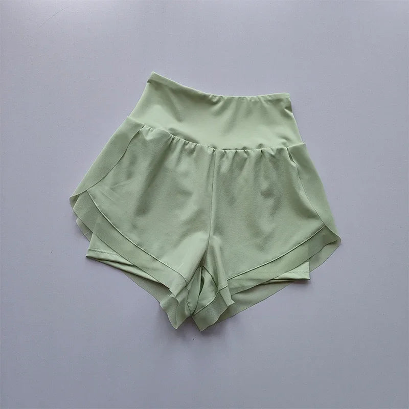 Light green high-waisted sports shorts women with a flowy design, perfect for workouts and casual wear