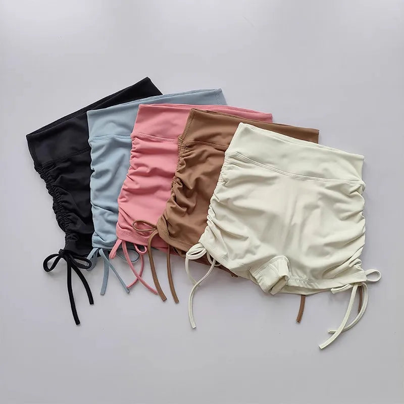 Six pairs of ladies high waist workout shorts in various colors including black, pink, blue, brown, and white