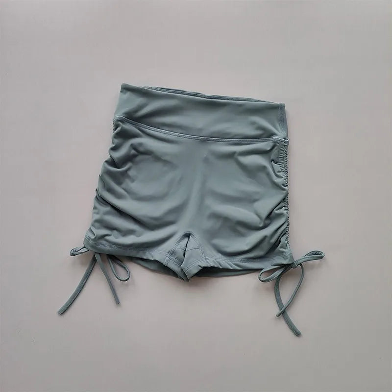 Ladies high waist workout shorts in light blue with adjustable side ties for comfort and style