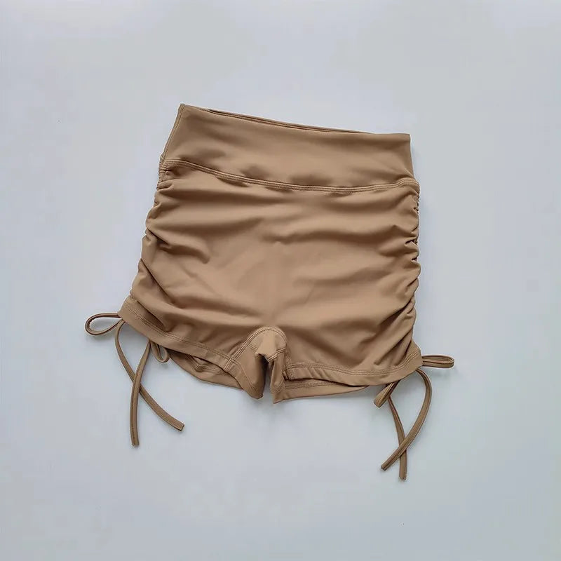 Ladies high waist workout shorts in beige with adjustable side ties for a comfortable fit