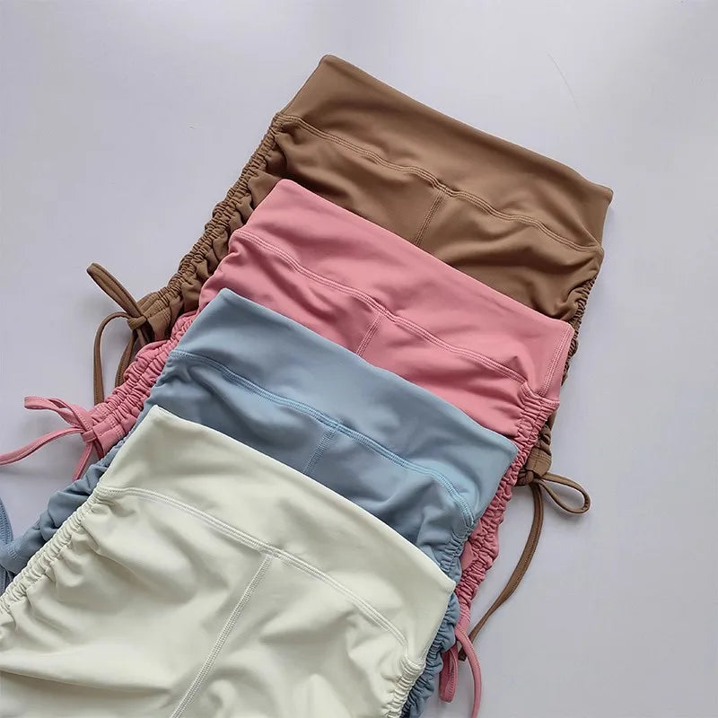 Collection of ladies high waist workout shorts in various colors with adjustable drawstrings