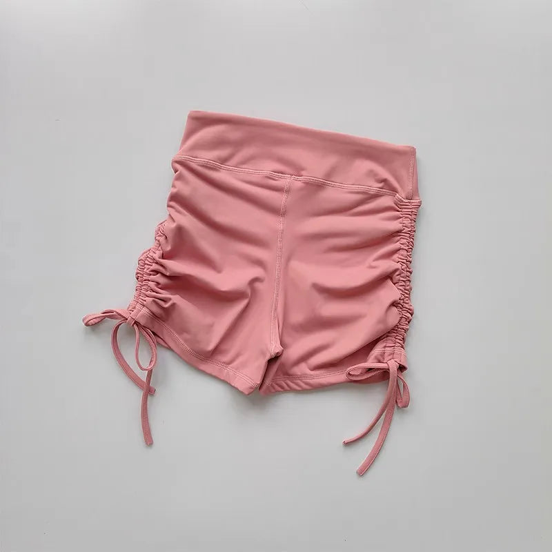 Pink ladies high waist workout shorts with adjustable side ties for a customizable fit