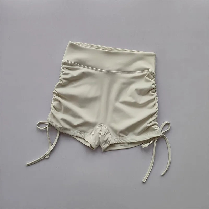 Ladies high waist workout shorts in cream color with adjustable drawstrings for a comfortable fit
