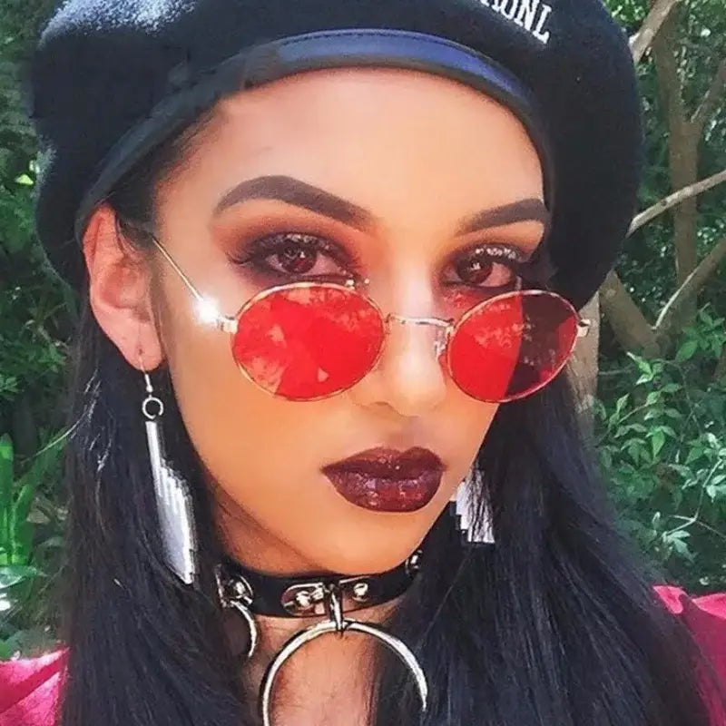 Fashionable luxury oval sunglasses women with red lenses for stylish summer outfits