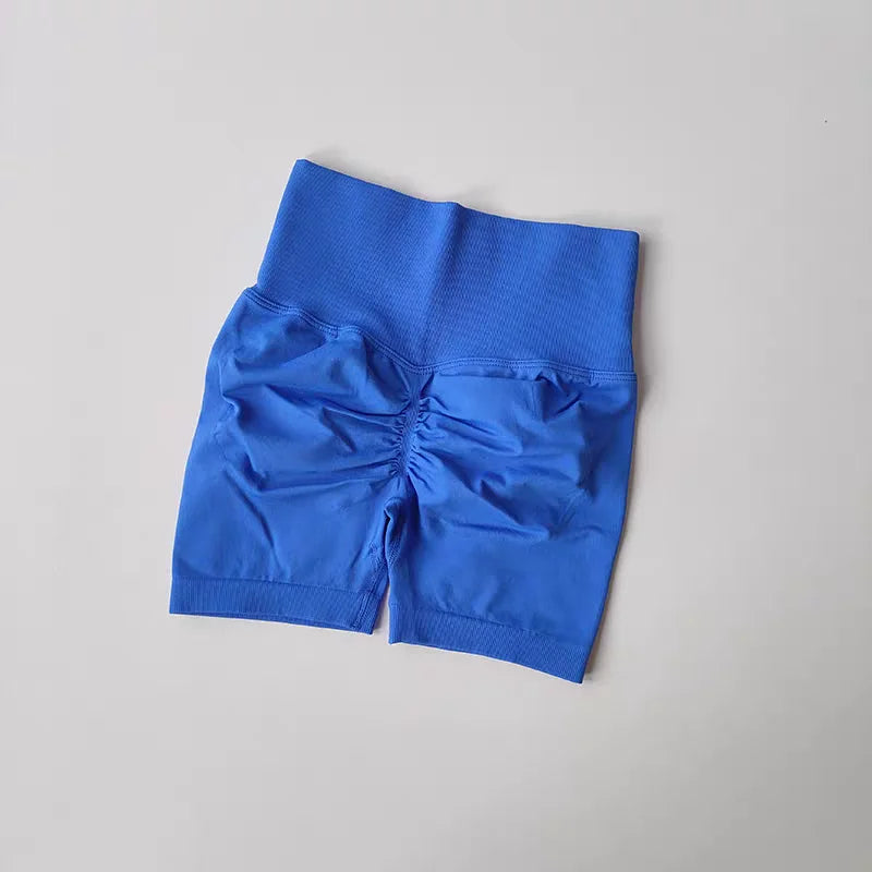 Blue push-up gym shorts for women with a flattering ruched design and comfortable waistband