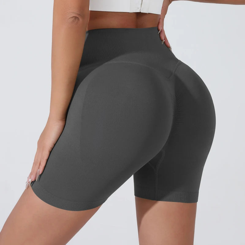 Stylish push-up gym shorts for women in dark gray, designed for comfort and support during workouts