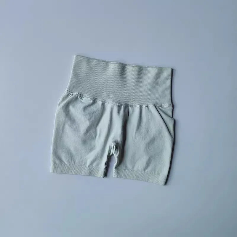 Light gray push-up gym shorts for women with a high waistband for enhanced comfort