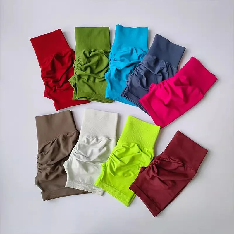 Variety of push-up gym shorts for women in multiple colors including red, green, blue, and pink