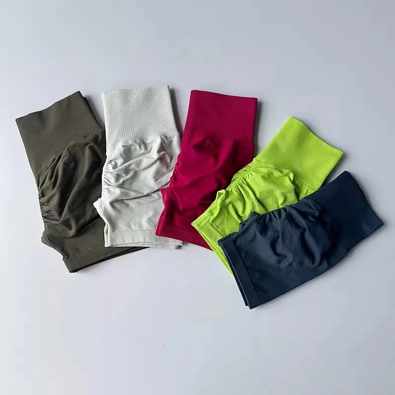 Variety of push-up gym shorts for women in green, pink, gray, and black for activewear fashion
