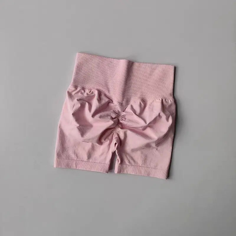 Pink push-up gym shorts for women with a high waistband and scrunch design for a flattering fit