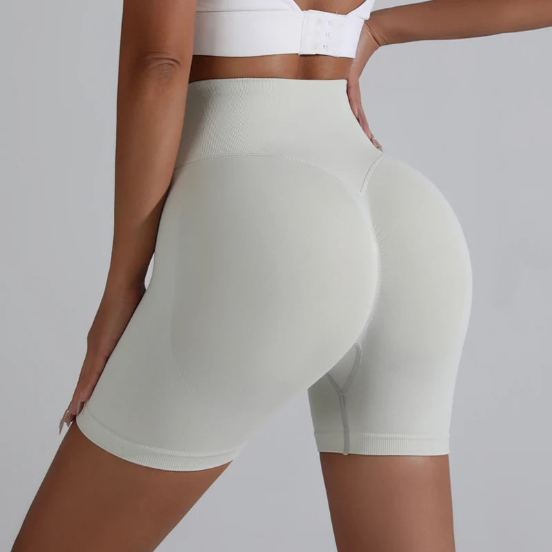 Light gray push-up gym shorts for women designed for comfort and style during workouts