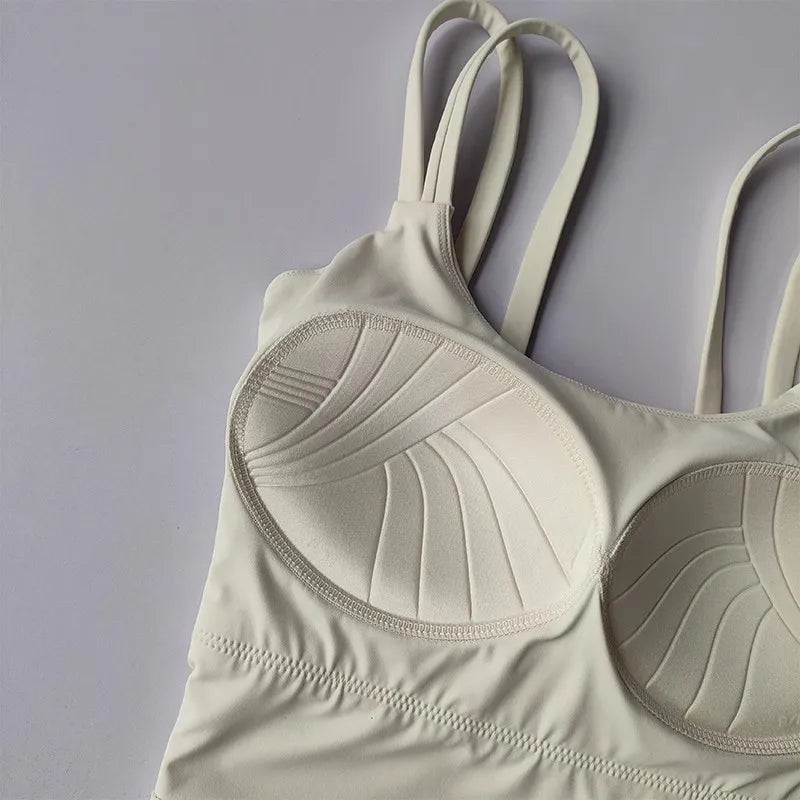 Beige push up sports bras for women with stylish ribbed design and adjustable straps