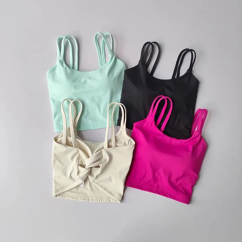 Set of four stylish push up sports bras for women in mint, black, beige, and pink colors