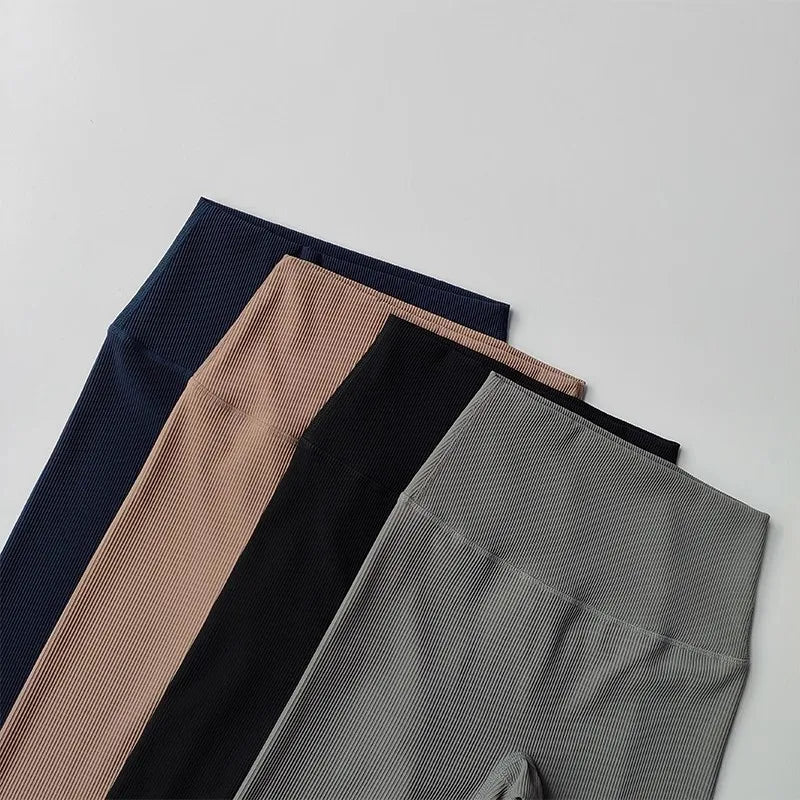 Ribbed cycling yoga gym shorts for women in four stylish colors displayed in a flat lay