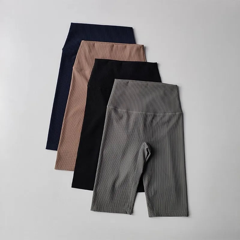 Ribbed cycling yoga gym shorts for women in four stylish colors neatly arranged
