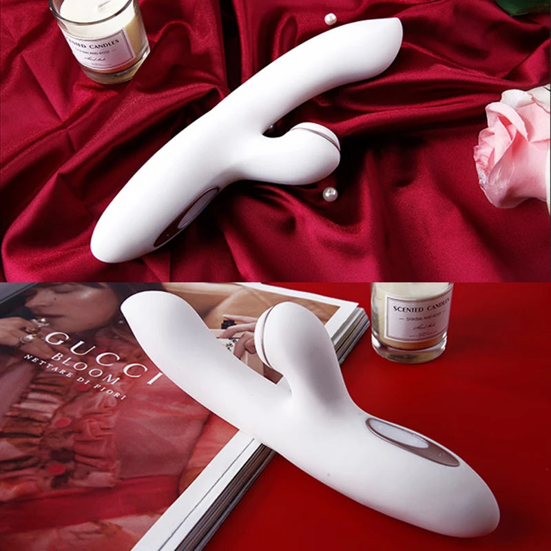 White silicone dual stimulation G spot sucking vibrator on red satin with clitoral arm candle rose display